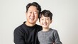 © Julia Jones - Happy Asian Father and Son Smiling Together