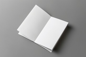 Poster - A close-up of an open white book on a gray background