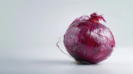 Poster - A single red onion placed on a white table, great for food and kitchen-related imagery