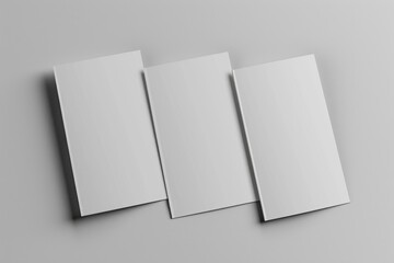 Aufkleber - Three blank white paper sheets laid out on a gray surface, ideal for use as a background or for creating a minimalist design