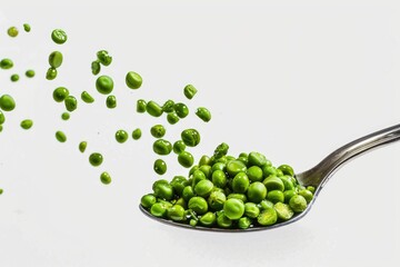 Wall Mural - Fresh green peas arranged on a clean white surface