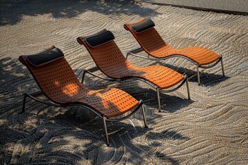 Sticker - A pair of bright orange chairs sitting on the edge of a sidewalk, great for outdoor settings or urban scenes