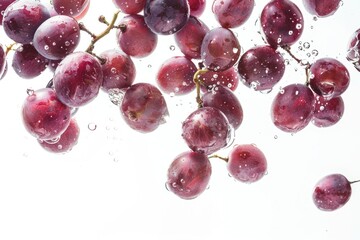 Poster - Fresh grapes being dropped into a glass of water, great for a health and wellness image or food photography