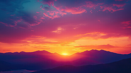 Wall Mural - A vibrant sunset over mountain range with colorful skies evokes tranquility