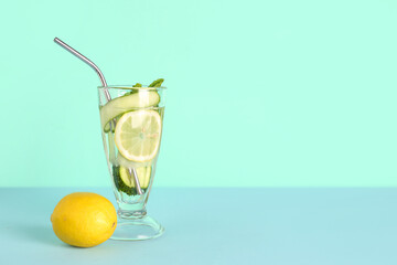 Poster - Glass of lemonade with cucumber and mint on blue background