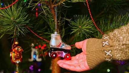 Roller skates. Christmas tree toy decorations. New Year and Merry Christmas. Live christmas tree with garlands and toys.