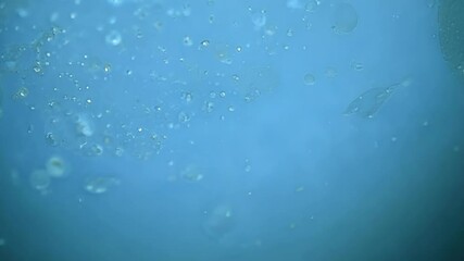 Aufkleber - Abstract background formed by a blue liquid with bubbles and blurry shapes, creating an interesting composition with space for text