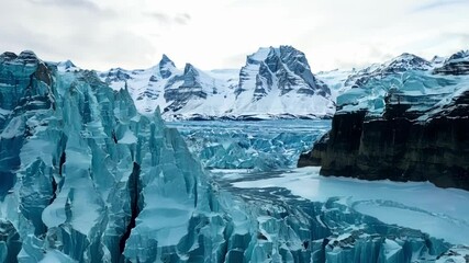 Aufkleber - Vivid turquoise glacier ice formations are juxtaposed against snow covered mountains, creating a breathtaking frozen landscape