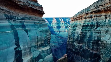 Poster - Sunlight illuminating the colorful rock formations of a narrow canyon, creating a sense of vastness and the grandeur of nature