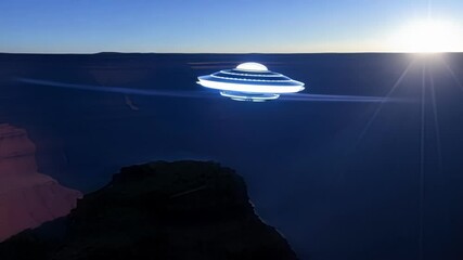 Poster - Large, glowing alien spaceship is hovering in the night sky over the grand canyon. The spaceship is casting a blue light on the canyon walls
