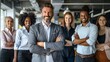 © bvbflo1 - Confident business leader standing with diverse team