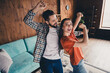 © deagreez - Photo of attractive trendy cheerful have fun dancing married young couple spending free time move new apartment home interior indoors