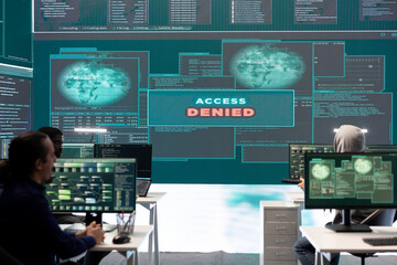 Poster - displeased irritated team of hackers with denied access message on a big screen in governmental oper