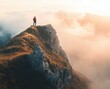 © UA_PM - hiker standing on the edge of mointain looking at sunset