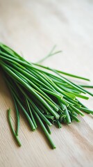 Wall Mural -  a bunch of fresh chives leaves herb on a wooden surface