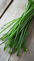 Canvas Print -  a bunch of fresh chives leaves herb on a wooden surface