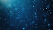 © panumas - A blue background with lots of small dots. The dots are scattered all over the background, creating a sense of movement and energy. The blue color of the background gives the image a calm