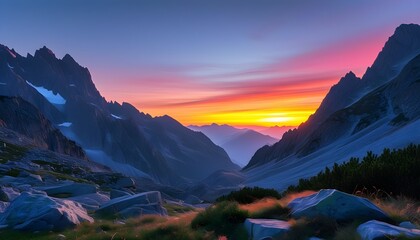 Wall Mural - Twilight tranquility over majestic mountains with vibrant sunset hues illuminating the sky and peaks