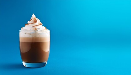 Wall Mural - a glass of coffee with whipped cream on a blue background perfect for a copy space image