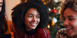 © Gabriela - Close up of woman talking and smiling with her friends at Christmas
