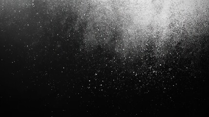 Abstract texture of white powder explosion on black background.