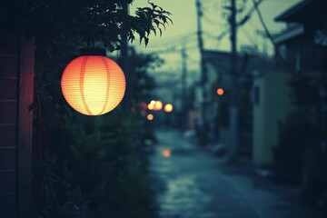 Wall Mural - A single glowing paper lantern hanging in a dark, narrow alleyway.