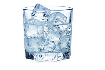 Glass filled with crushed ice overflowing on table, isolated on white background.