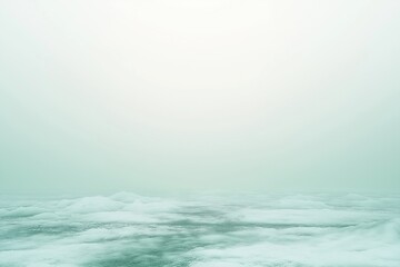 Frozen lake disappearing into the fog on cold winter day