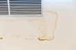 © Eakrin - Ceiling stain and cracked and mold after air conditioner has water drop leak on air grille.