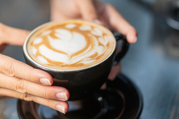 Beautiful Latte Art in a Black Cup