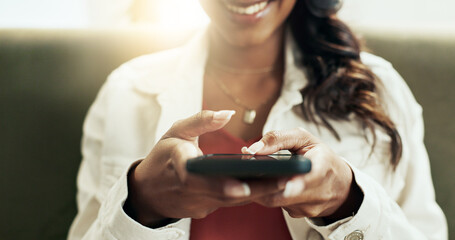 Poster - Hands, phone and social media with happy woman on sofa in living room of home for communication closeup. App, smile and text message with person typing on mobile in apartment for online networking