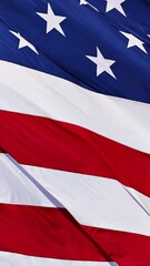 Wall Mural - close up of the us flag blowing in the breeze.