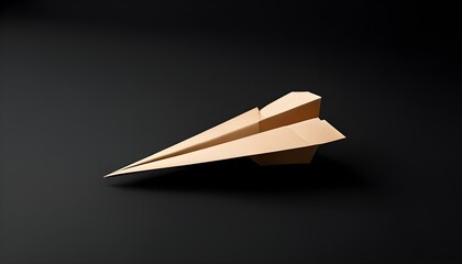 Wall Mural - Minimalist brown paper airplane on sleek black background