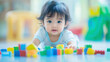 © Daniil - A child plays with toy blocks