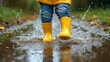 © A4719 - Yellow Rain Boots Splashing in Puddle on Rainy Day