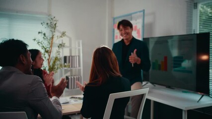Poster - Group of four businesspeople claps hands in unison, celebrating a successful project outcome during an office meeting, radiating happiness and teamwork