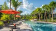 © JIALU - Sunny day at upscale Florida pool with lounge chairs, red umbrella, palm trees, and lush greenery, capturing luxury real estate living.