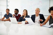 © peopleimages.com - Group, pitch meeting and team management with presentation, paperwork or corporate seminar. Desk, negotiation and listening with diversity, document and business people in office in conference room