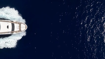 Wall Mural - aerial overhead close up view of a bow of a luxury yacht sailing with high speed over the ocean with