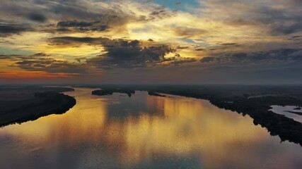 Wall Mural - aerial view landscape with beautiful sunset with dramatic sky reflection on danube river, 4k