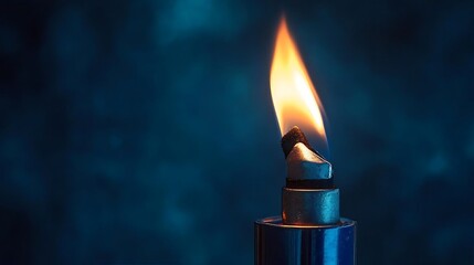 Poster - Flame Burning on a Blue Background