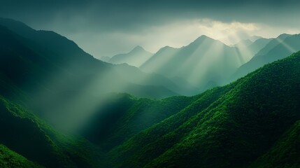 Wall Mural -  Over the mountain range, sunlight filters through clouds, revealing green foreground hills dotted with grass