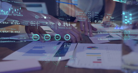 Canvas Print - Image of diagrams and data processing over diverse colleagues discussing work in office