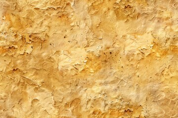 A close-up of a textured yellow wall with peeling paint, showcasing a vintage aesthetic.