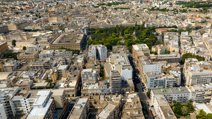 Aerial view of the Giuseppe Garibaldi public gardens in Lecce, Puglia, Italy. It is a green area with trees and flowerbeds in the historic center of the apulian city