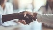 © Galib - Two people shaking hands, a close-up.