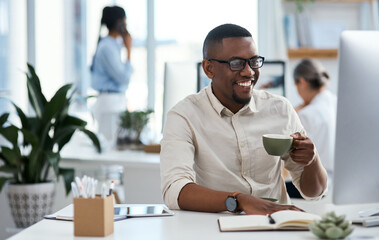 Coffee, computer and black man at digital agency with smile, ideas or creative developer in office. Reading, website designer or consultant at tech startup with drink, relax and online business plan