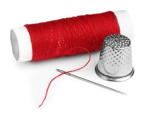 Sticker - Thimble and needle with red sewing thread isolated on white