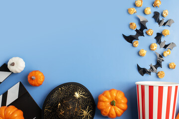 Halloween movie, popcorn and clapperboard, cinema ticket background, party treats with tasty caramel pop corn, theater blackboard and fun holiday celebration