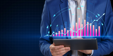 Poster - Businessman analyzing digital financial data on tablet, with upward candlestick chart in background.